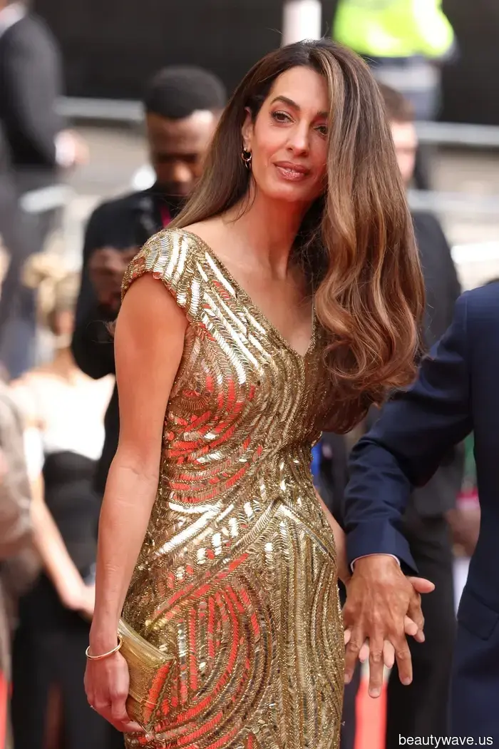 Amal Clooney's stylish dress trend will be seen at every black-tie wedding you go to this summer.