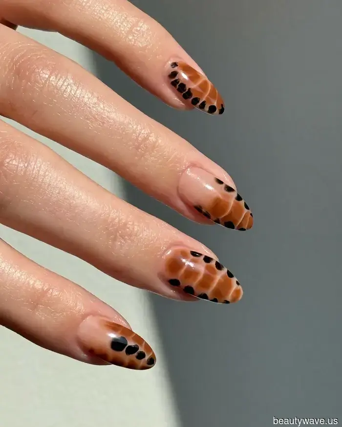 The most prominent fall manicure trends this year feature coquette elements and vibrant, rich hues.