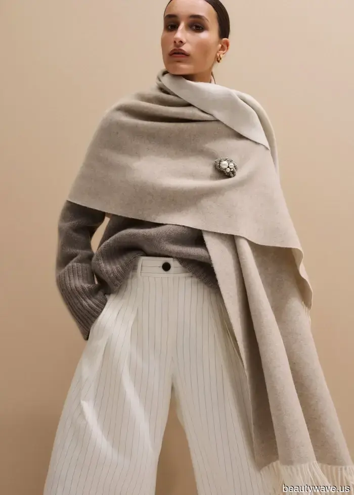If you want your airport looks to exude first-class style, swap your jacket for this chic essential instead.