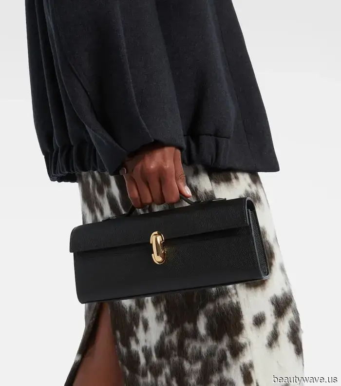 If you're holding this sophisticated handbag style, it shows you have a classic sense of fashion.