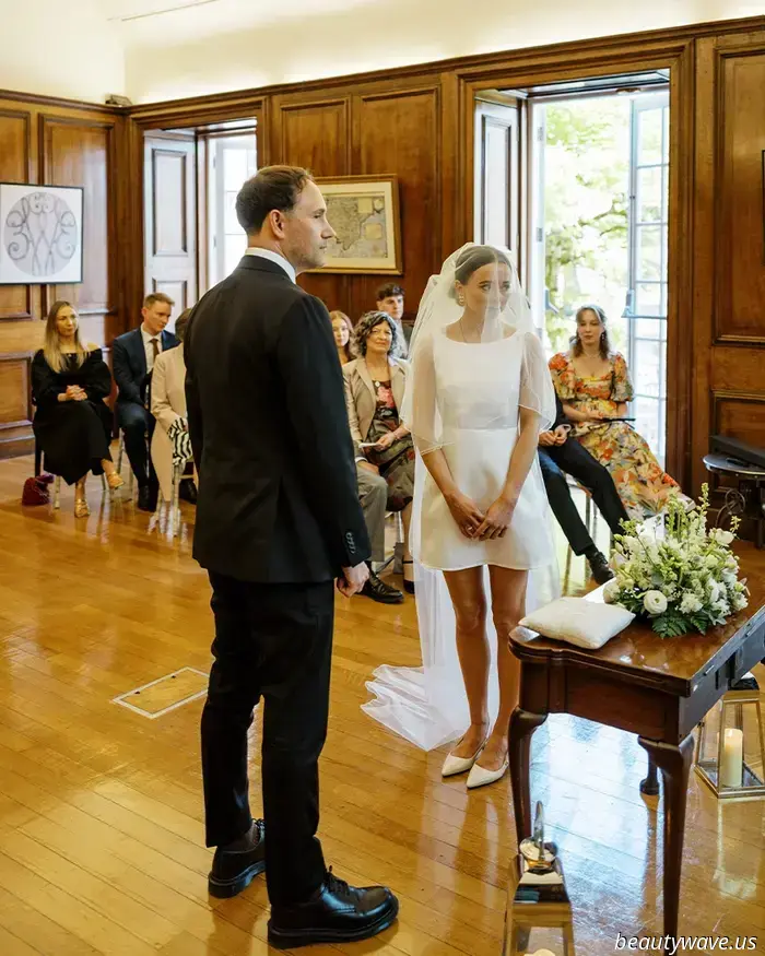 This lovely bride donned a stylish Reformation minidress for her intimate wedding in Wales, which had 26 guests.