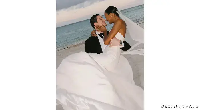 The bride donned a custom-made dress, while the groom opted for Ralph Lauren for their stunning beach wedding in the Caribbean.