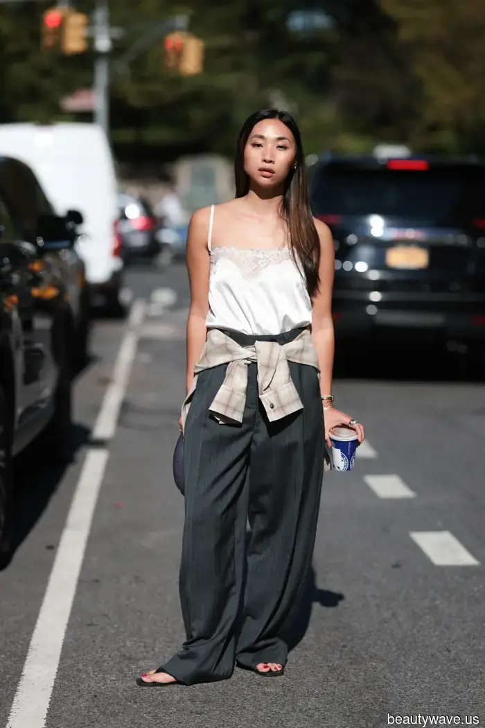 Forget Silk Scarves—Fashion Enthusiasts Everywhere Are Now Wrapping This Fall Essential Around Their Waists Instead.
