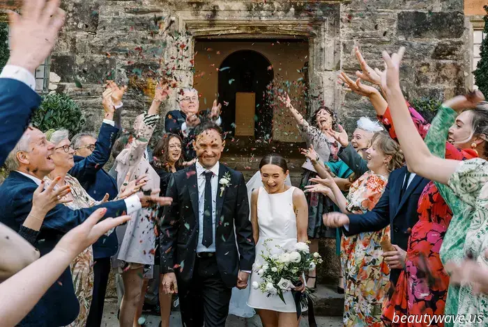This lovely bride donned a stylish Reformation minidress for her intimate wedding in Wales, which had 26 guests.