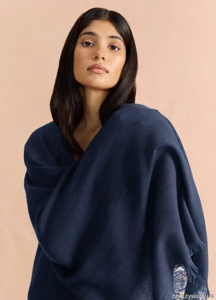 If you want your airport looks to exude first-class style, swap your jacket for this chic essential instead.