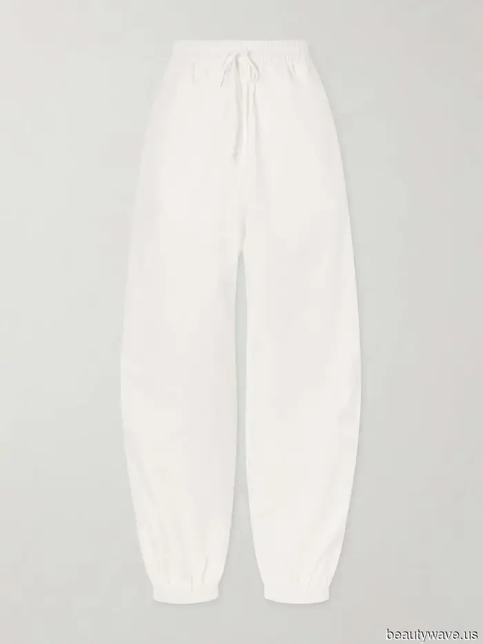 Fashion enthusiasts continue to sport white sneakers—albeit with this pant trend rather than jeans.