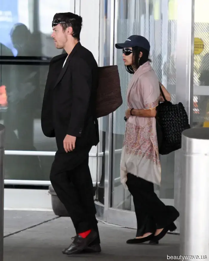 If you want your airport looks to exude first-class style, swap your jacket for this chic essential instead.