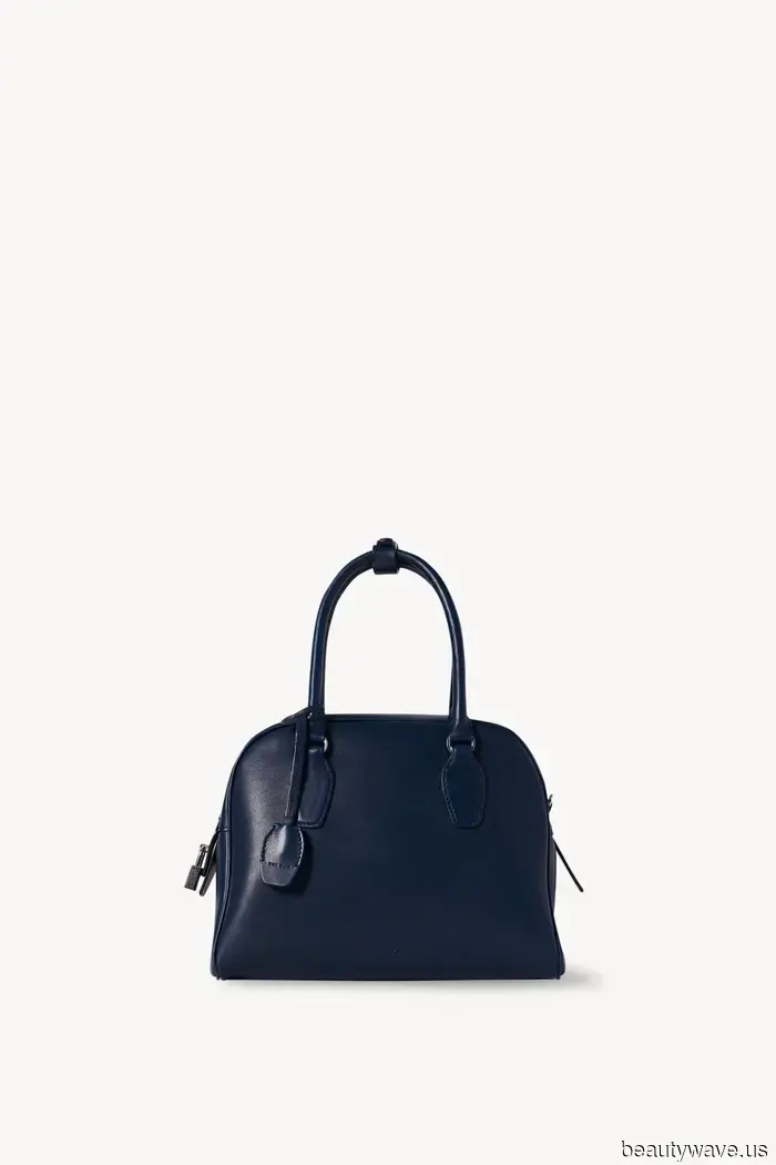 If you're holding this sophisticated handbag style, it shows you have a classic sense of fashion.