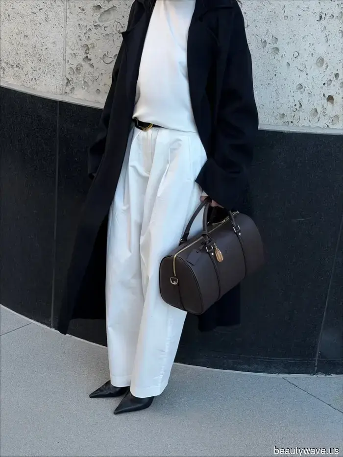 If you're holding this sophisticated handbag style, it shows you have a classic sense of fashion.