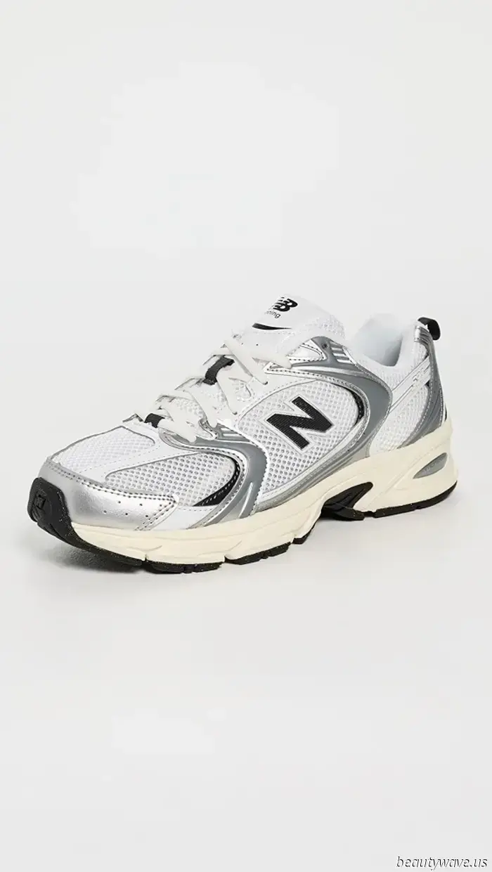 Not Black, Not White: The 2025 Sneaker Color Trend That Fashion Enthusiasts Are Currently Sporting at the Airport.