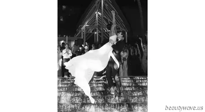 The bride donned a custom-made dress, while the groom opted for Ralph Lauren for their stunning beach wedding in the Caribbean.