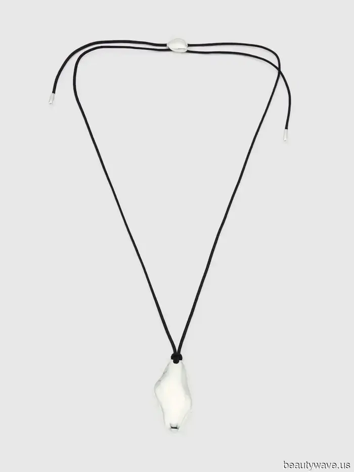 The Unexpected Jewelry Trend That People Are Pairing With Coats and Sweaters This Season