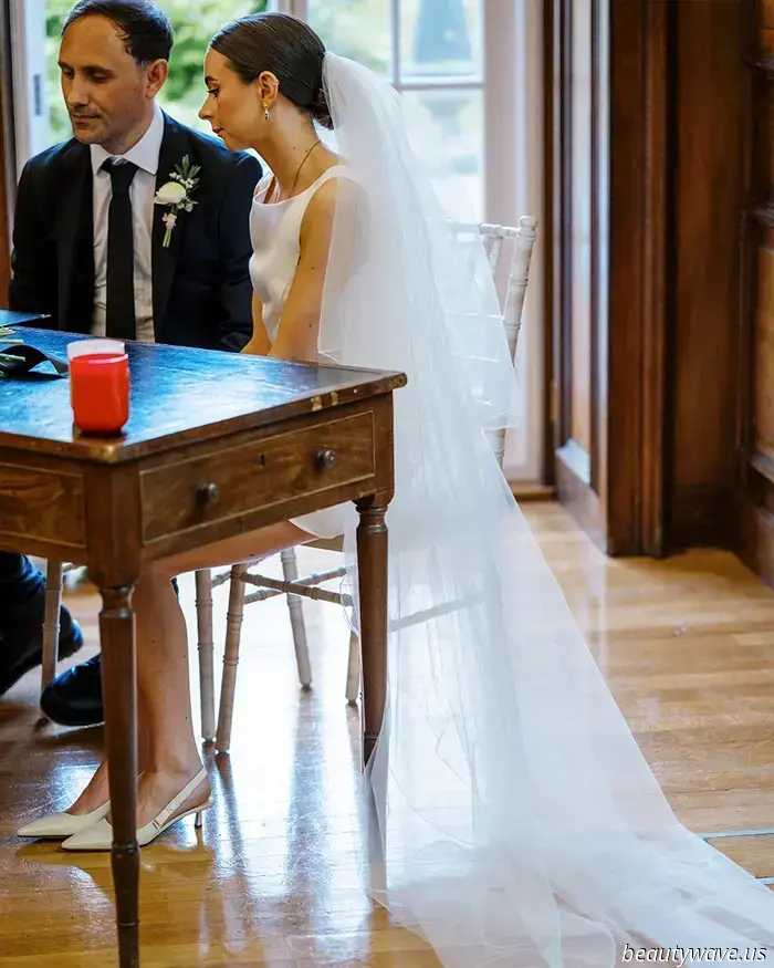 This lovely bride donned a stylish Reformation minidress for her intimate wedding in Wales, which had 26 guests.