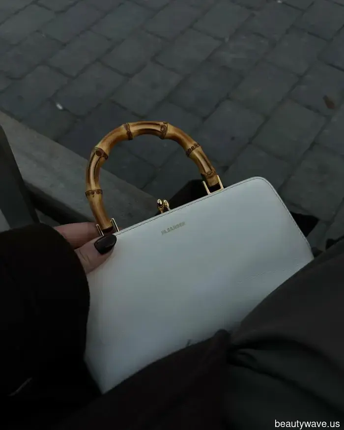 If you're holding this sophisticated handbag style, it shows you have a classic sense of fashion.