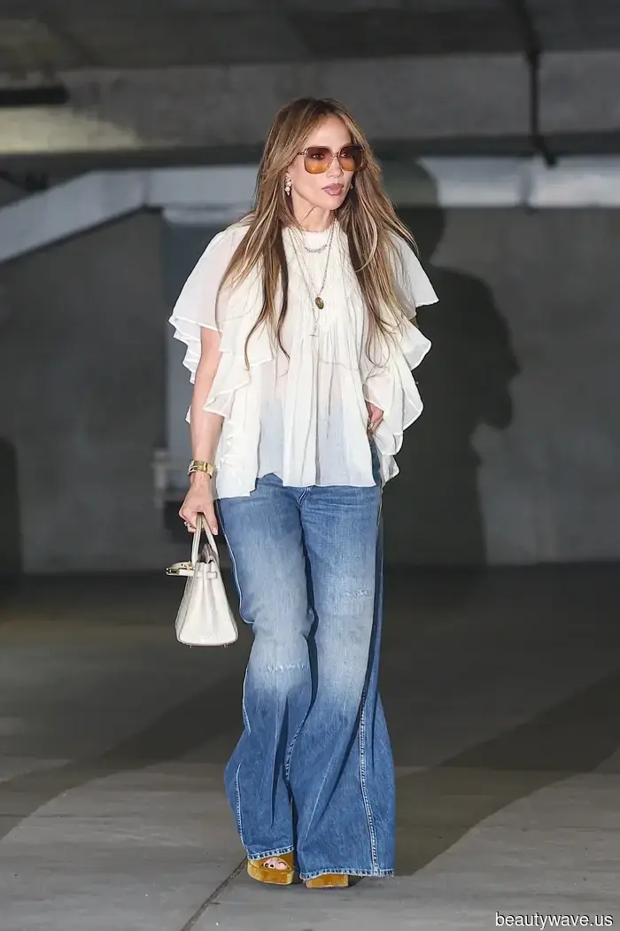 Achieving a Chic Look with Wide-Leg Jeans Involves Pairing Them with These Stylish Blouses and Shoe Trends.