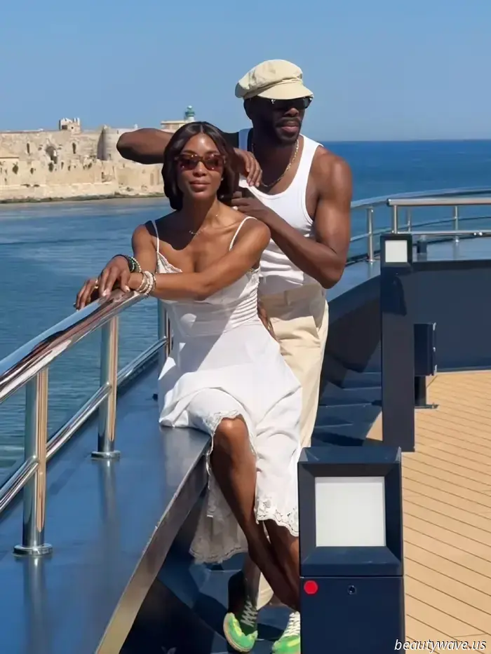 On a yacht in Sicily, there is just one sneaker color that matches perfectly with a white sundress.