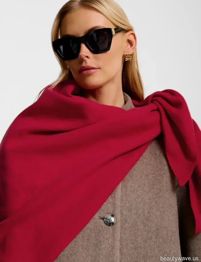 If you want your airport looks to exude first-class style, swap your jacket for this chic essential instead.