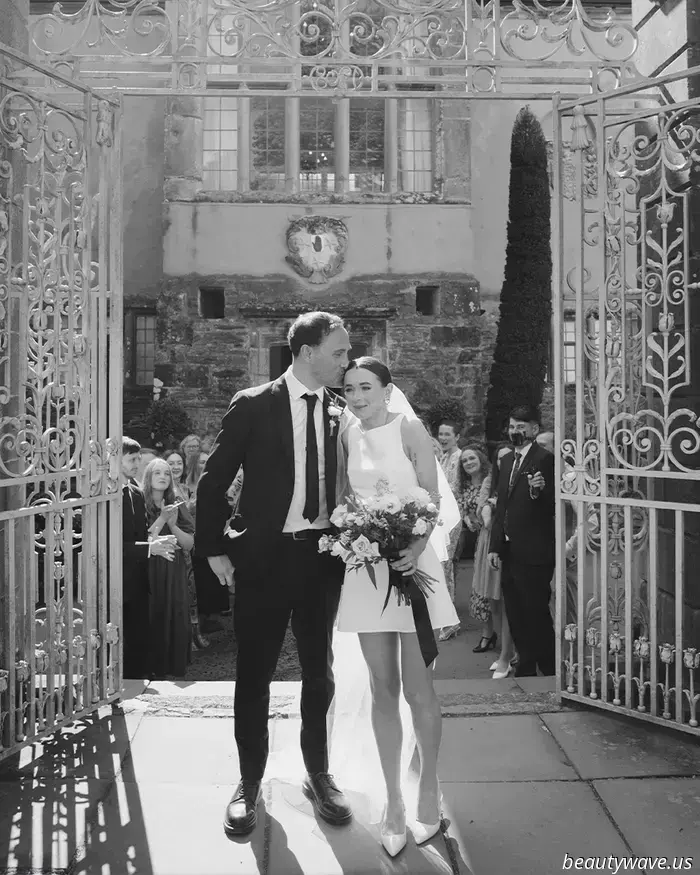 This lovely bride donned a stylish Reformation minidress for her intimate wedding in Wales, which had 26 guests.