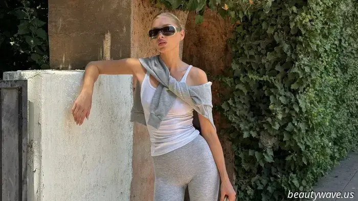 Der nicht-weiße Sneaker-Farbtrend, den Models gerade mit Leggings und Jeans tragen.